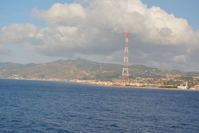 Sea against cloudy sky