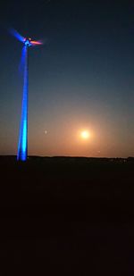 Scenic view of silhouette field against sky at night