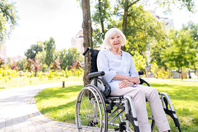 Portrait of woman sitting on road