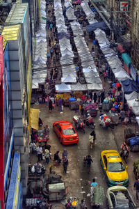 High angle view of people on street market