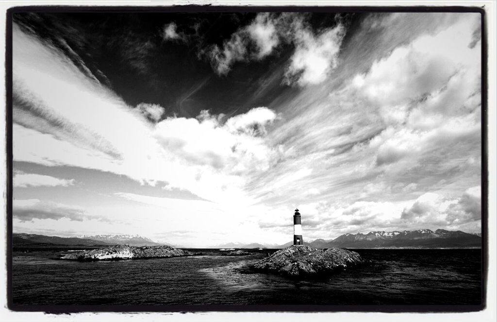 transfer print, water, sky, sea, auto post production filter, cloud - sky, tranquility, tranquil scene, scenics, cloud, nature, horizon over water, waterfront, cloudy, built structure, beauty in nature, architecture, rippled, building exterior, day