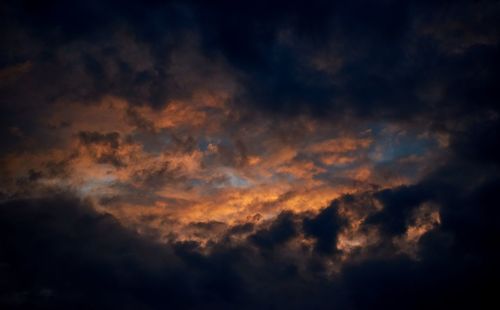 Low angle view of dramatic sky during sunset