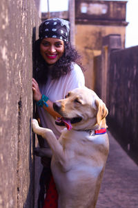 Portrait of young woman with dog