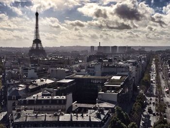 Cityscape against cloudy sky