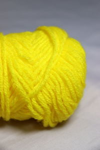 Close-up of yellow leaf on table