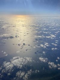 Aerial view of clouds over sea against sky