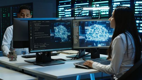 Midsection of businessman using laptop at office