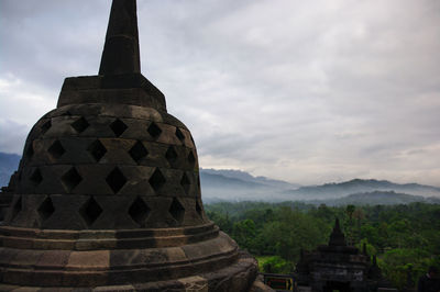 View of borobodur temple against cloudy sky yogjarkata merapi