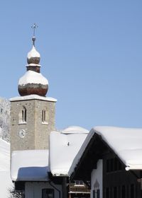 Low angle view of church against clear blue sky