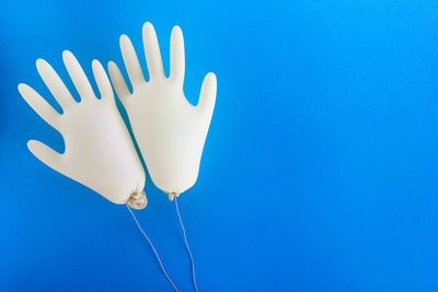Low angle view of white background against blue sky