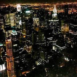 Aerial view of illuminated cityscape at night