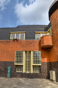 Facades of  brick construction of residential building in amsterdam school style architecture