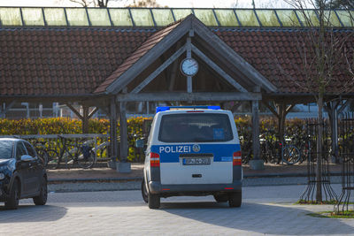 Car on street by houses in city