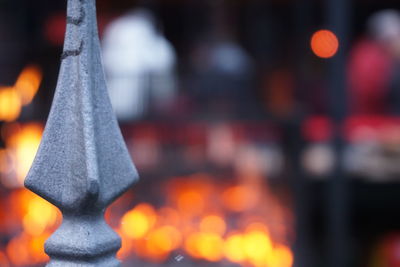 Close-up of cross against blurred background