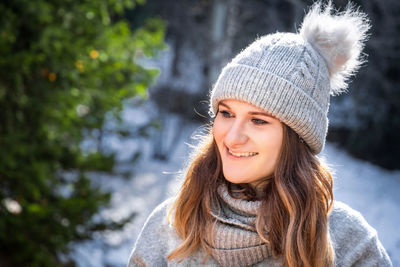 Portrait of young woman wearing warm clothes