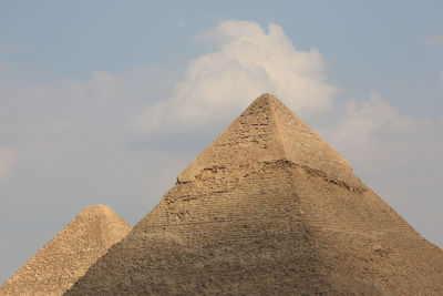 Low angle view of castle against cloudy sky