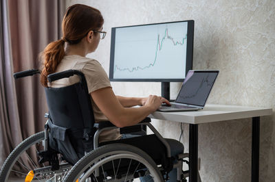 Young woman using laptop at home