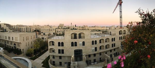 Buildings against sky during sunset