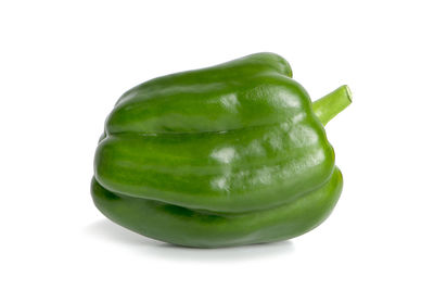 Close-up of green pepper against white background