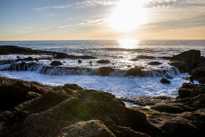 Scenic view of sea against sky during sunset