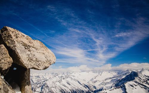 Low angle view of mountain against blue sky