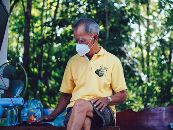 Portrait of young man using mobile phone