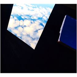 Buildings against cloudy sky