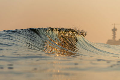 Scenic view of beach against sky during sunset
