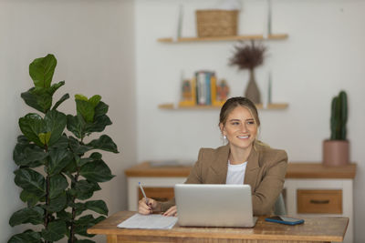 Woman working at home with laptop. home office.  notebook for working. 