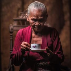 Senior woman having tea