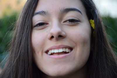 Portrait of smiling woman wearing flowers