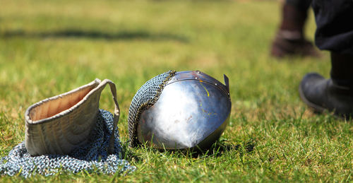 Low section of men with ball on field