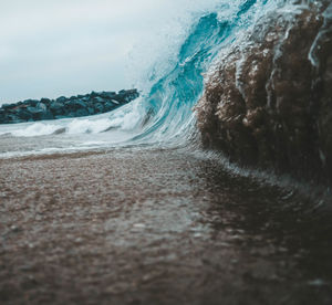 Surface level of beach against sky