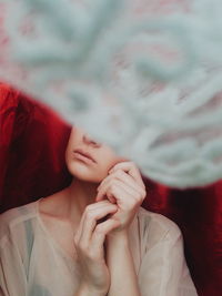 Close-up of woman face covered with textile