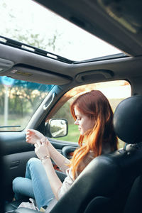 Woman sitting in car