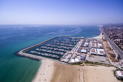 Aerial view of city by sea