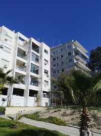 Low angle view of building against blue sky