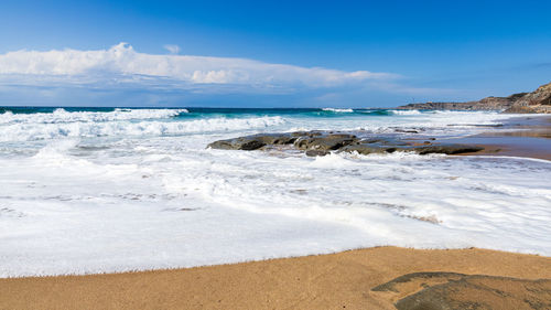 Scenic view of beach against sky