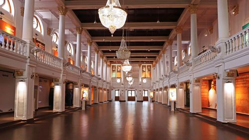 Low angle view of illuminated chandelier in building