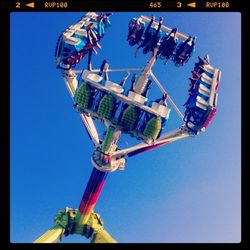 Low angle view of tree against blue sky