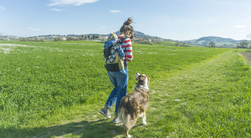 Full length of a dog on field