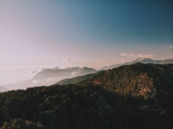 Scenic view of mountains against sky during sunset