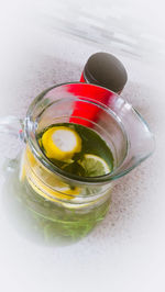 High angle view of drink in glass on table