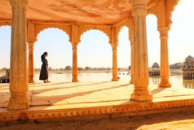 Full length of man standing at historic building