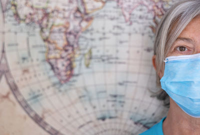 Close-up portrait of woman wearing mask