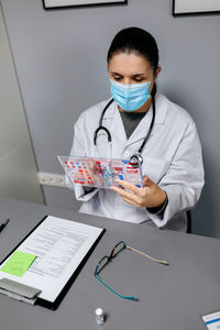 Doctor examining patient in clinic