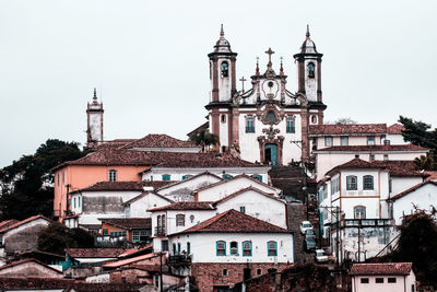 Church of nossa senhora do carmo amidst houses against clear sky