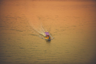 High angle view of boat sailing on sea