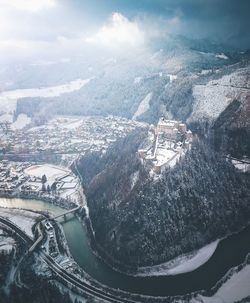 High angle view of snowcapped mountain against sky