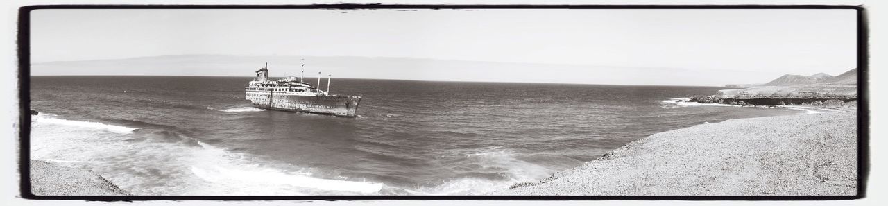 transfer print, water, sea, auto post production filter, beach, sand, nature, tranquility, shore, day, wood - material, outdoors, horizon over water, panoramic, tranquil scene, sunlight, beauty in nature, no people, scenics, close-up